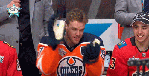 A Hockey Player Wearing A Jersey That Says " Oilers " GIF
