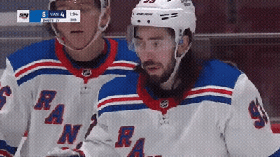 A Hockey Player Wearing A Jersey That Says Rangers Stands Next To Another Player GIF