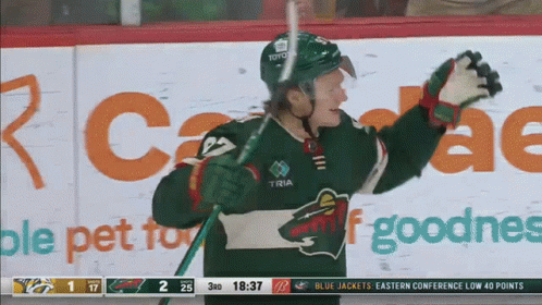 A Hockey Player Wearing A Jersey That Says ' Toyota ' On It GIF