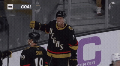A Hockey Player Wearing A Jersey That Says Vegas GIF