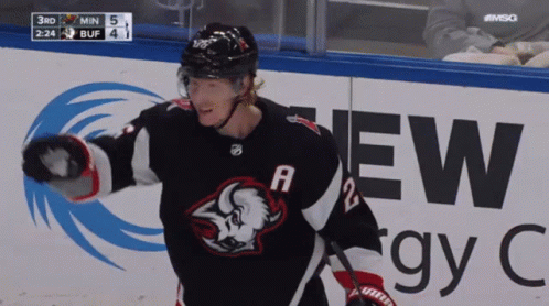 A Hockey Player Wearing A Jersey With A Buffalo On The Front GIF