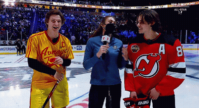 A Hockey Player Wearing A Jersey With The Letter A On It Talks To A Reporter GIF