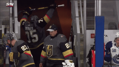 A Hockey Player Wearing A Jersey With The Number 15 On It GIF