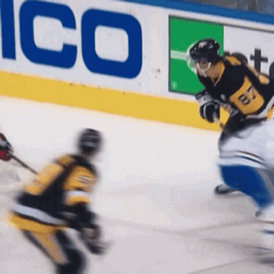 A Hockey Player Wearing A Jersey With The Number 17 On It Is Skating On The Ice GIF
