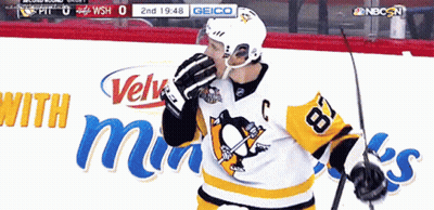 A Hockey Player Wearing A Jersey With The Number 18 On It GIF