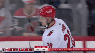 A Hockey Player Wearing A Jersey With The Number 20 GIF