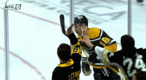 A Hockey Player Wearing A Jersey With The Number 26 On It GIF