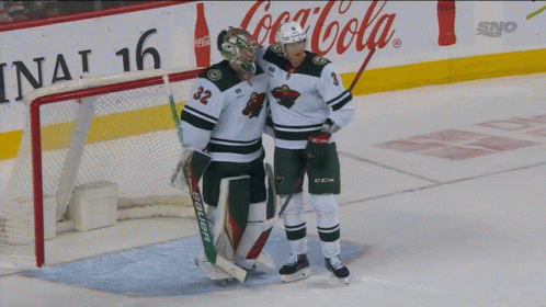 A Hockey Player Wearing A Jersey With The Number 33 On It GIF