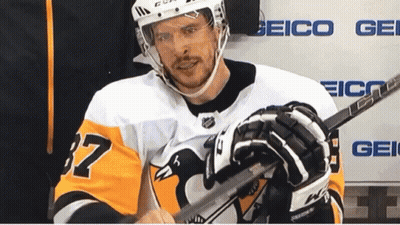 A Hockey Player Wearing A Jersey With The Number 37 On It GIF
