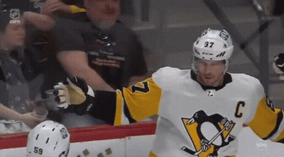 A Hockey Player Wearing A Jersey With The Number 37 On It GIF