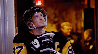 A Hockey Player Wearing A Jersey With The Number 37 On It GIF