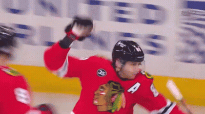 A Hockey Player Wearing A Jersey With The Number 4 On It GIF