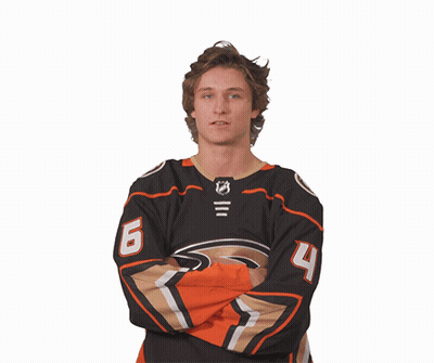 A Hockey Player Wearing A Jersey With The Number 6 And 4 On It GIF