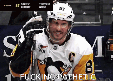 A Hockey Player Wearing A Jersey With The Number 8 On It GIF