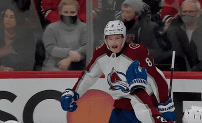 A Hockey Player Wearing A Jersey With The Number 8 GIF