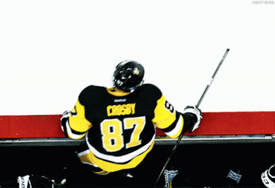A Hockey Player Wearing A Jersey With The Number 87 On It GIF
