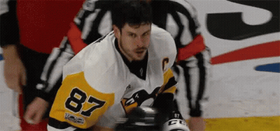 A Hockey Player Wearing A Jersey With The Number 87 On It GIF