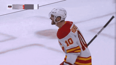 A Hockey Player Wearing A Number 10 Jersey GIF