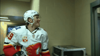 A Hockey Player Wearing A Number 18 Jersey GIF