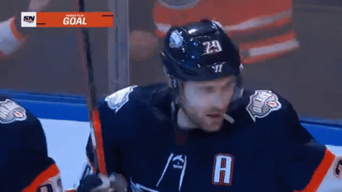 A Hockey Player Wearing A Number 29 Jersey GIF