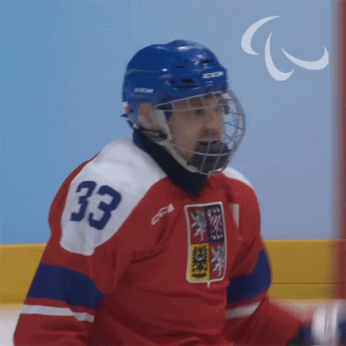 A Hockey Player Wearing A Number 33 Jersey GIF