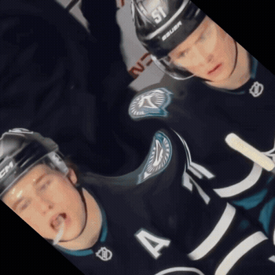 A Hockey Player Wearing A Number 4 Jersey GIF