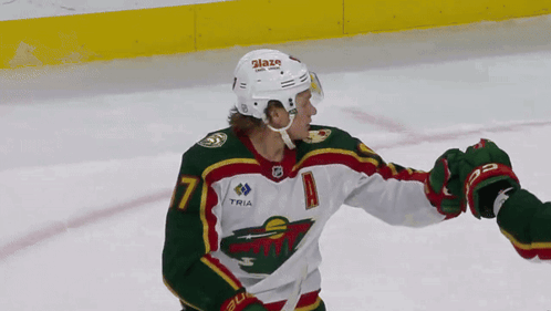 A Hockey Player Wearing A Number 7 Jersey GIF