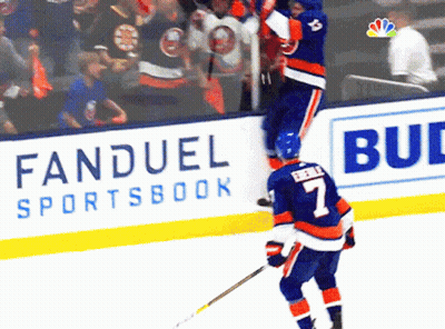A Hockey Player Wearing A Number 7 Jersey Stands On The Ice GIF