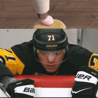 A Hockey Player Wearing A Number 71 Jersey GIF