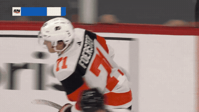 A Hockey Player Wearing A Number 71 Jersey GIF
