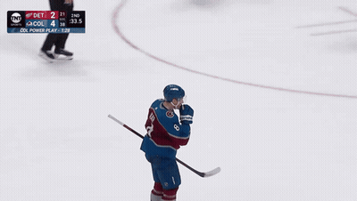 A Hockey Player Wearing A Number 8 Jersey GIF
