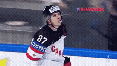 A Hockey Player Wearing A Number 87 Jersey Is Standing On A Rink . GIF