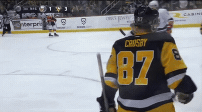 A Hockey Player Wearing A Number 87 Jersey Stands On The Ice GIF
