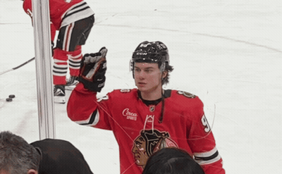 A Hockey Player Wearing A Red Jersey That Says Croca Sports GIF