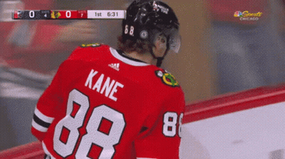 A Hockey Player Wearing A Red Jersey With Kane 88 On The Back GIF