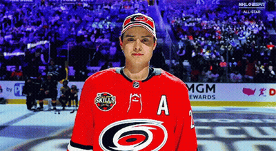 A Hockey Player Wearing A Red Jersey With The Letter A On The Front GIF