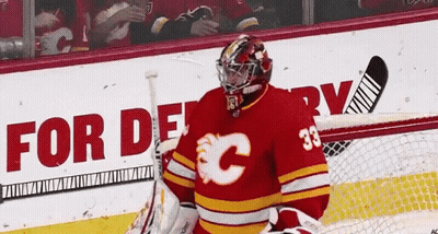 A Hockey Player Wearing A Red Jersey With The Number 33 GIF
