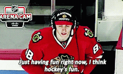 A Hockey Player Wearing A Red Jersey With The Number 8 GIF