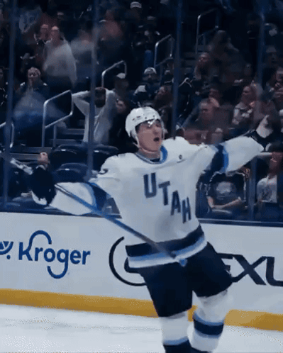 A Hockey Player Wearing A Utah Jersey Celebrates His Goal GIF