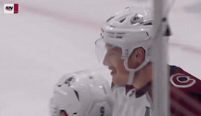 A Hockey Player Wearing A White Helmet With The Letter O On His Jersey GIF