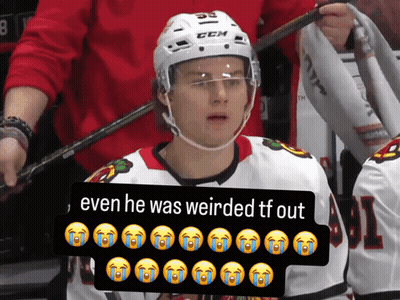 A Hockey Player Wearing A White Helmet With The Number 55 On It GIF