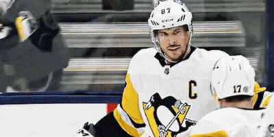 A Hockey Player Wearing A White Jersey With The Letter C On It GIF