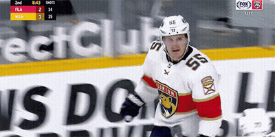 A Hockey Player Wearing A White Jersey With The Number 55 On It GIF