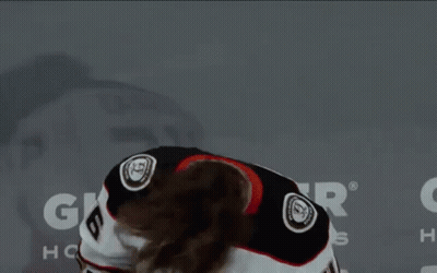 A Hockey Player Wearing A White Jersey With The Number 6 On It GIF