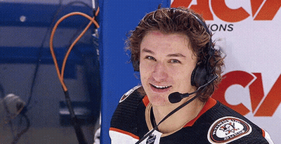 A Hockey Player Wearing Headphones And A Jersey That Says ' Washington Ducks ' On It GIF