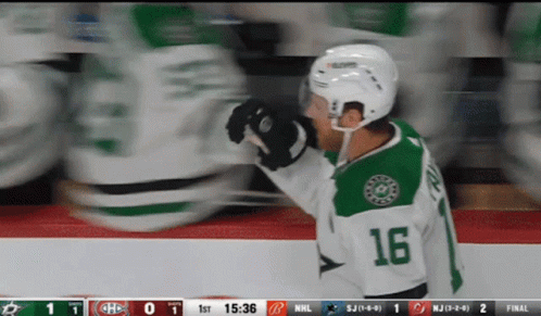 A Hockey Player Wearing The Number 16 Jersey GIF