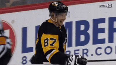 A Hockey Player Wearing The Number 87 Jersey GIF
