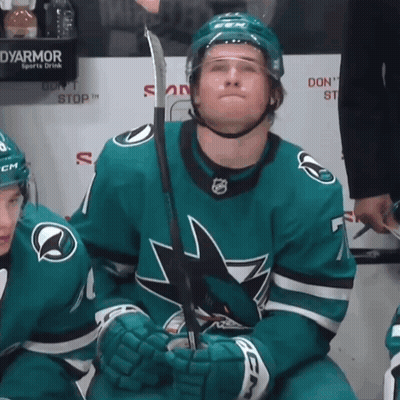 A Hockey Player With A Ccm Helmet Holds His Stick GIF