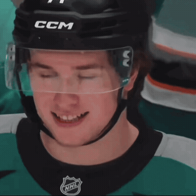 A Hockey Player With His Eyes Closed Wearing A Helmet That Says Ccm GIF