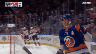 A Hockey Player With The Letter A On His Jersey Stands On The Ice GIF